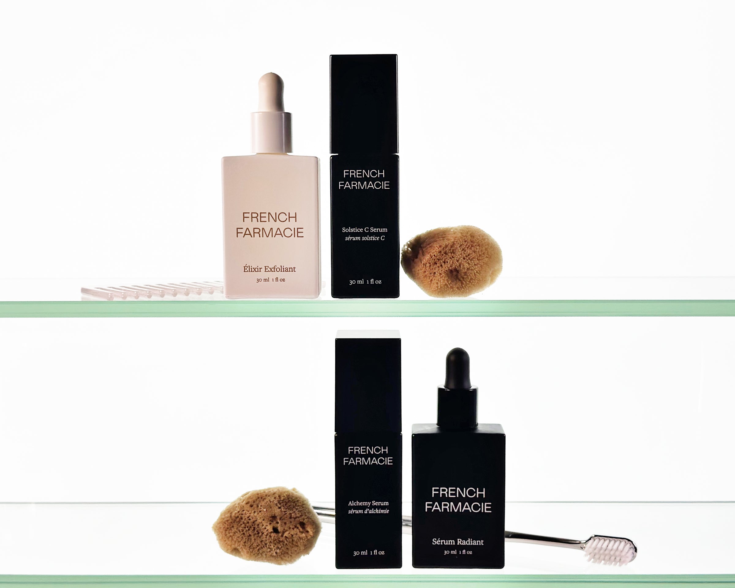 French Farmacie skincare products including bottles and sponges on a white background
