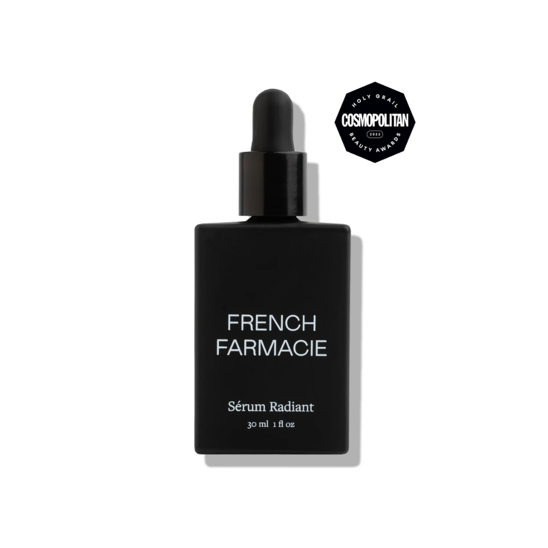 Black bottle of French Farmacie Sérum Radiant with dropper on a white background with award seal